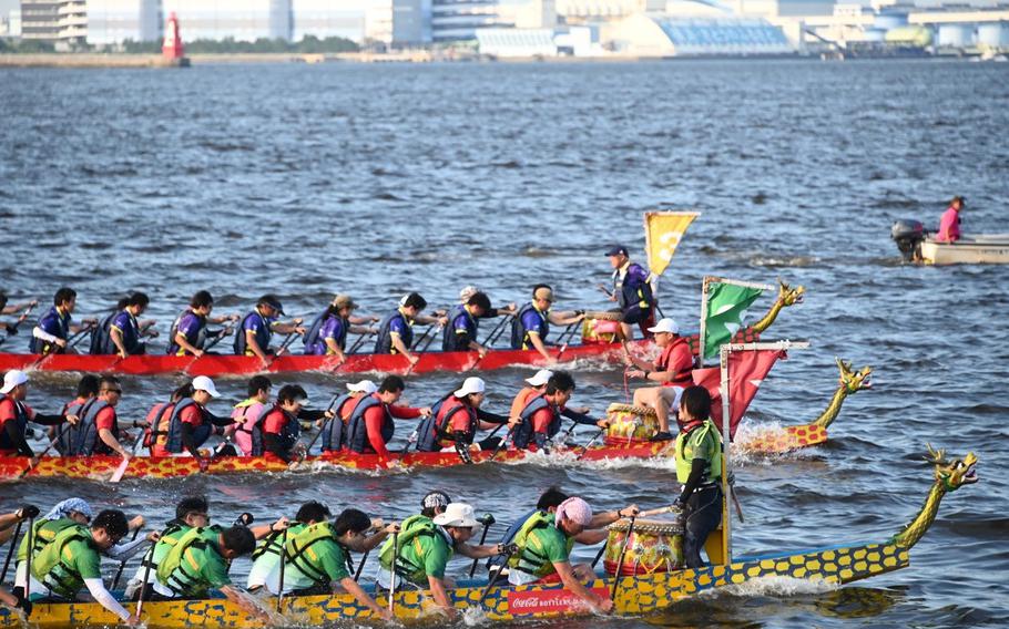 Two dragon boats racing.